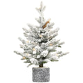 Flocked Christmas tree with potted base and 3 pine cones