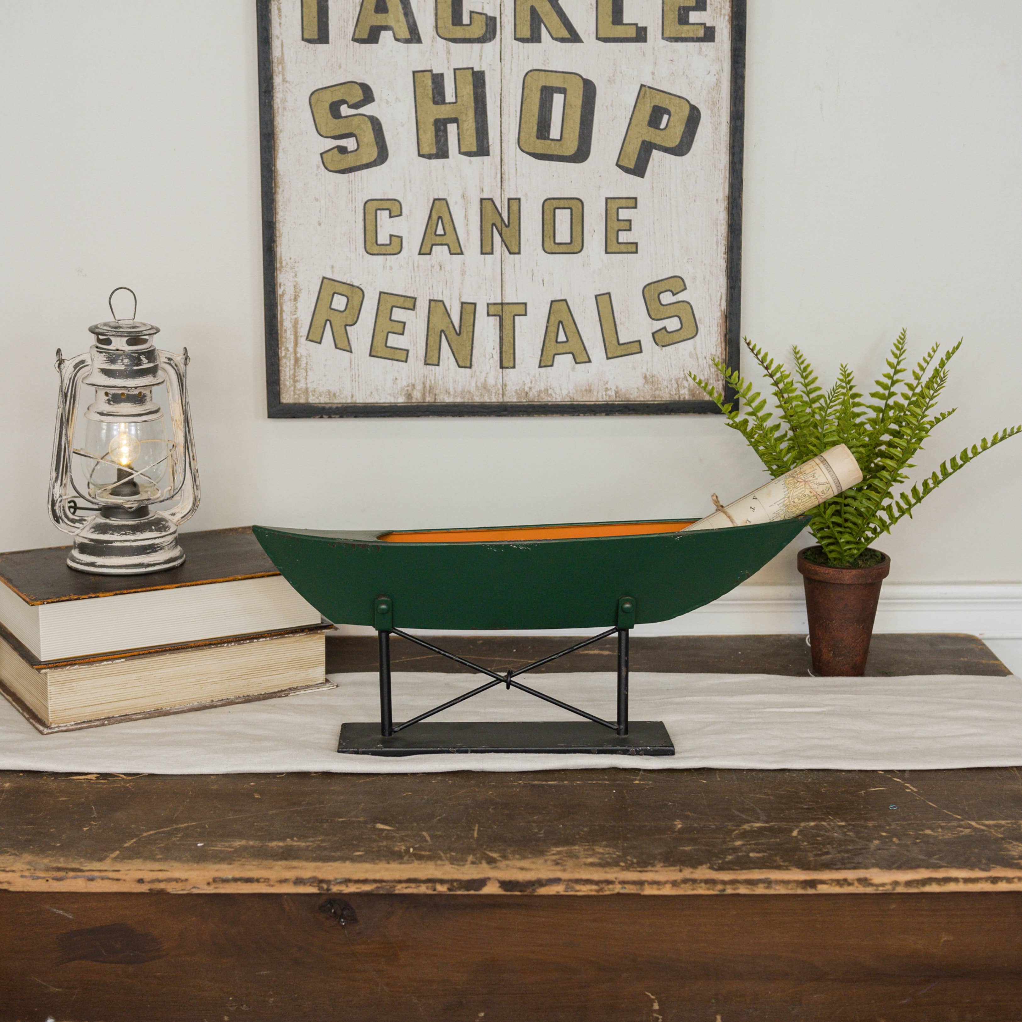 PAINTED GREEN BOAT ON STAND