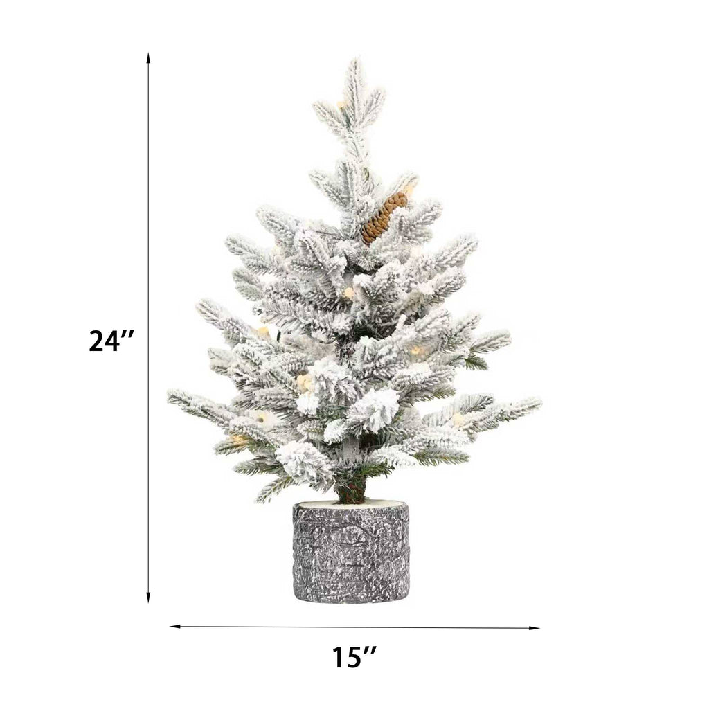 Flocked Christmas tree with potted base and 3 pine cones