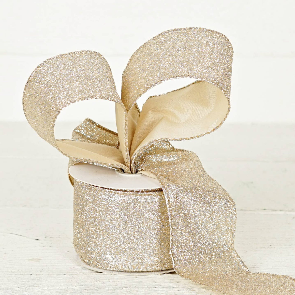 57R0910 - 2.5inWx10Yard Wired Ribbon-Champagne Glitter w. Go
