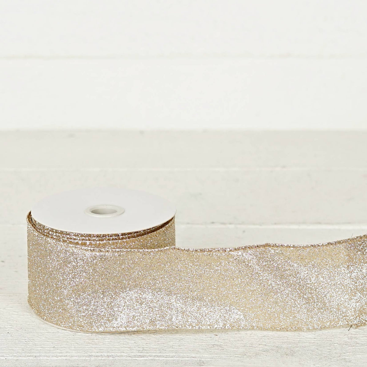 57R0910 - 2.5inWx10Yard Wired Ribbon-Champagne Glitter w. Go